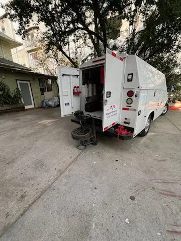 Magnet Plumbing service vehicle on-site for Grease Trap Cleaning in Cedar Pointe Condominiums